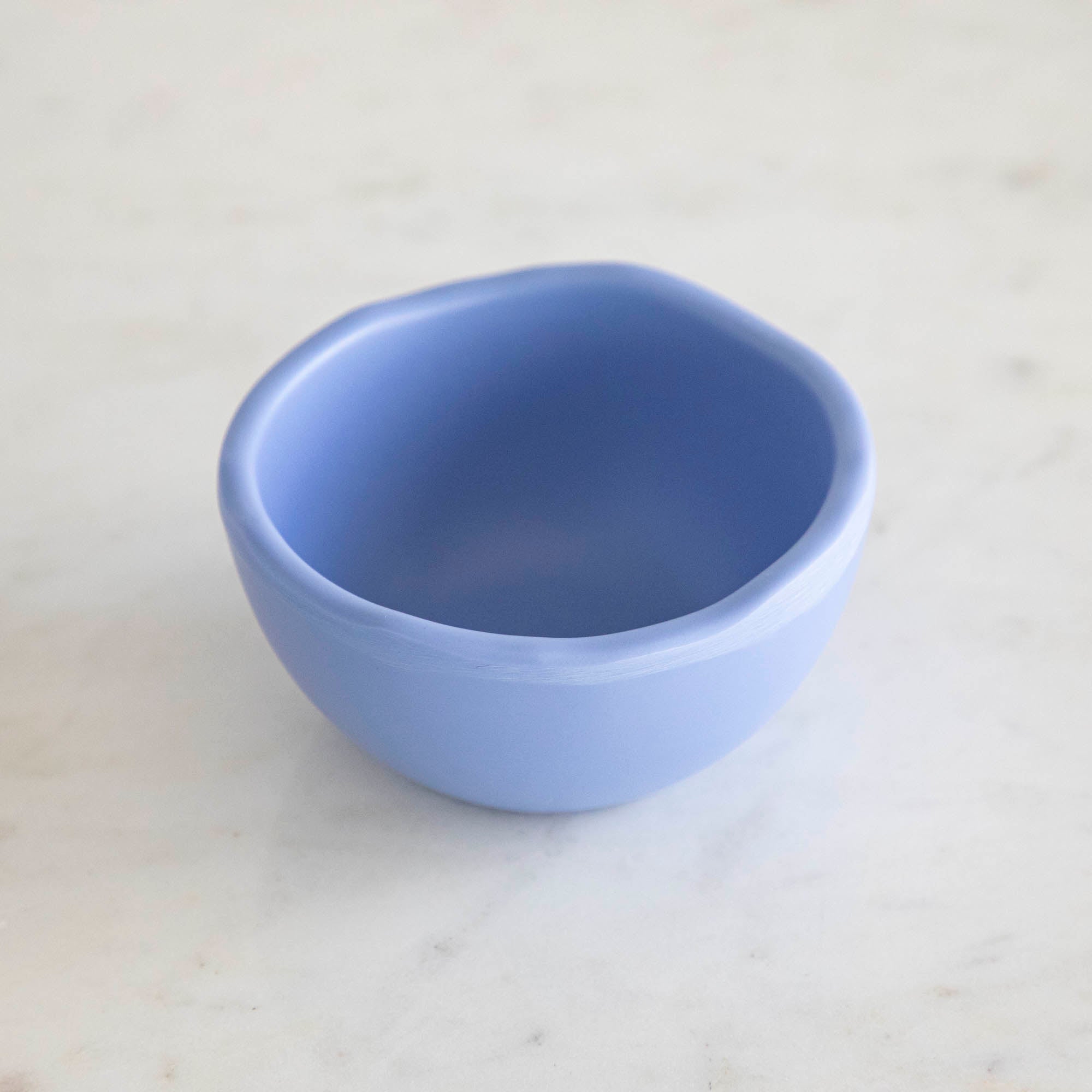 A set of colorful, dishwasher-safe Glitterville Rainbow Melamine Trinket Bowls on a table.