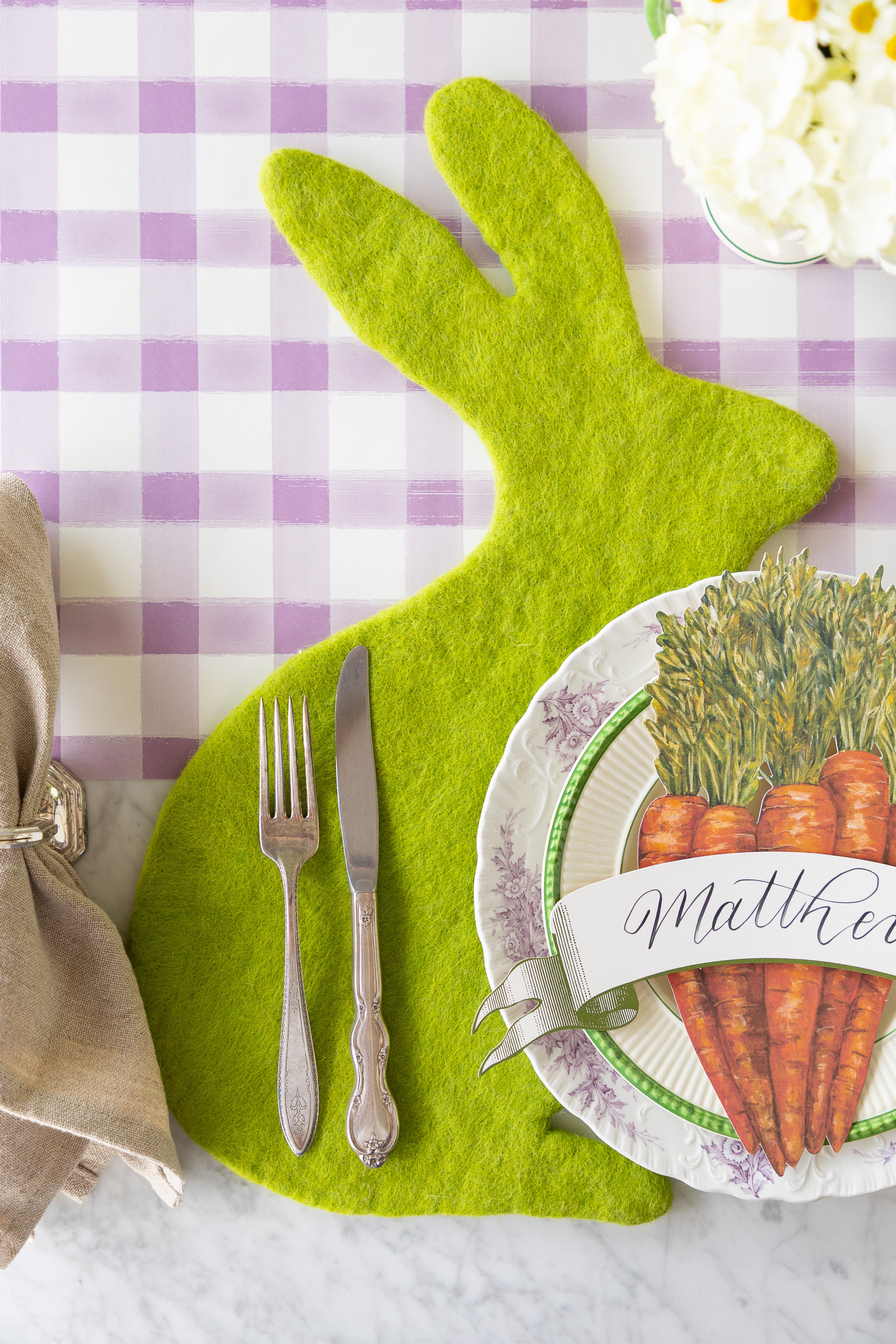 A place setting featuring the Spring Green Bunny Felt Placemat on the Lilac Painted Check Runner.