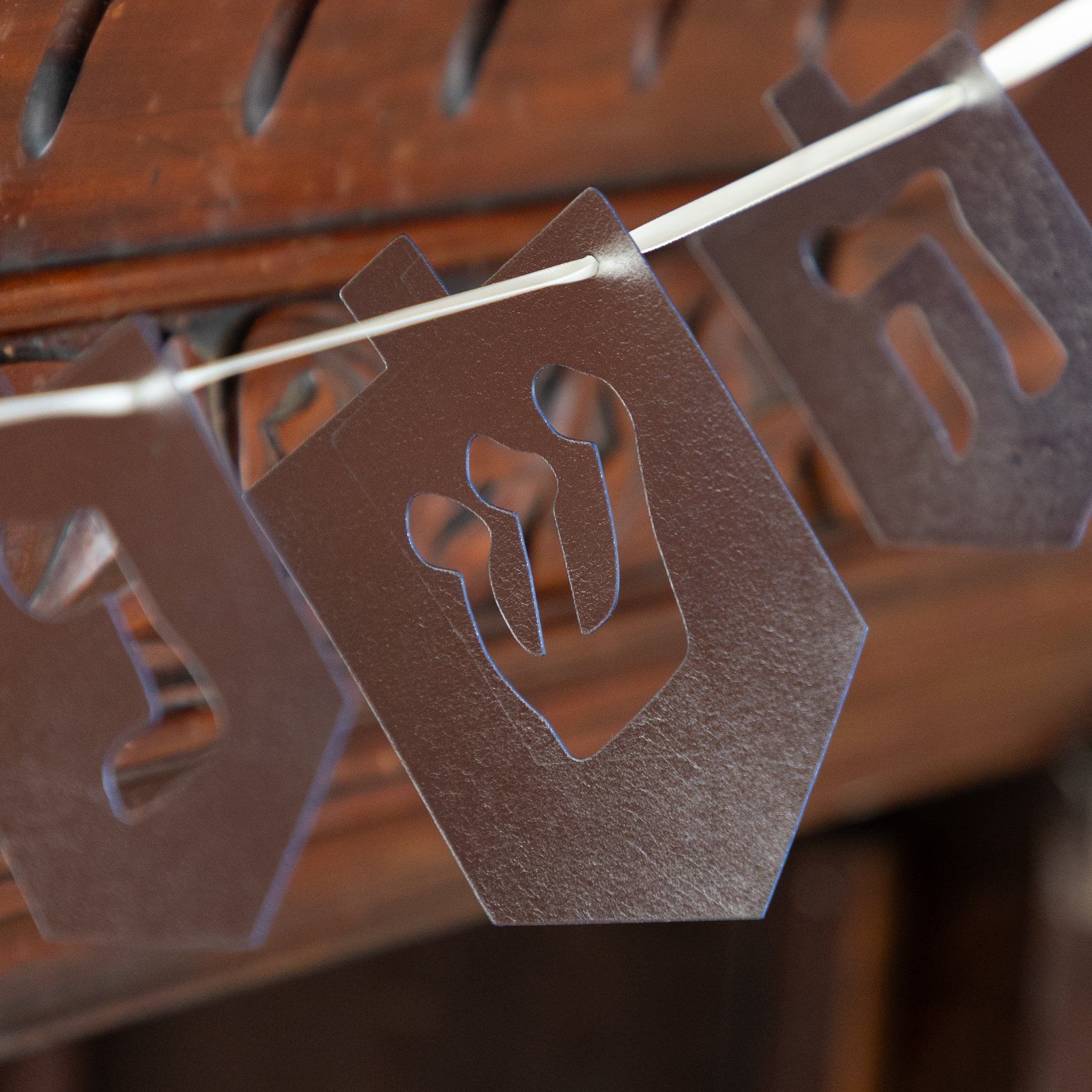 Decorative banner with cut-out letter &