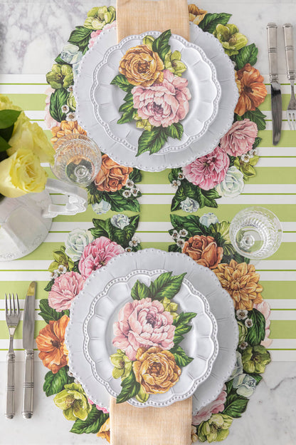 Top-down view of an elegant floral table setting, featuring Garden Derby Table Accents resting on each plate.