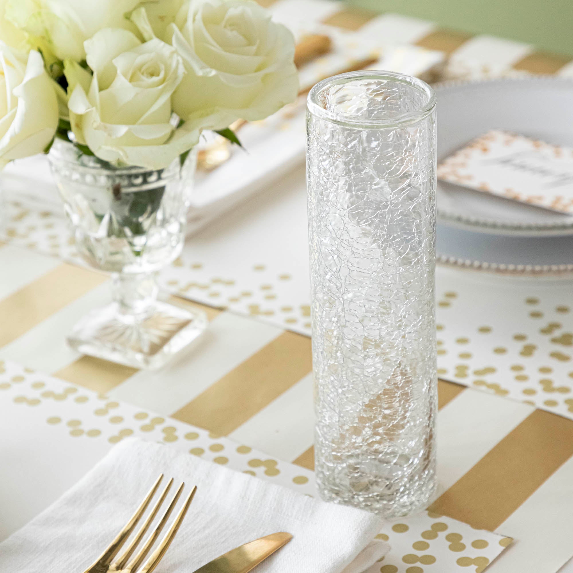 A tall Norwell Champagne Flute behind an elegant place setting.