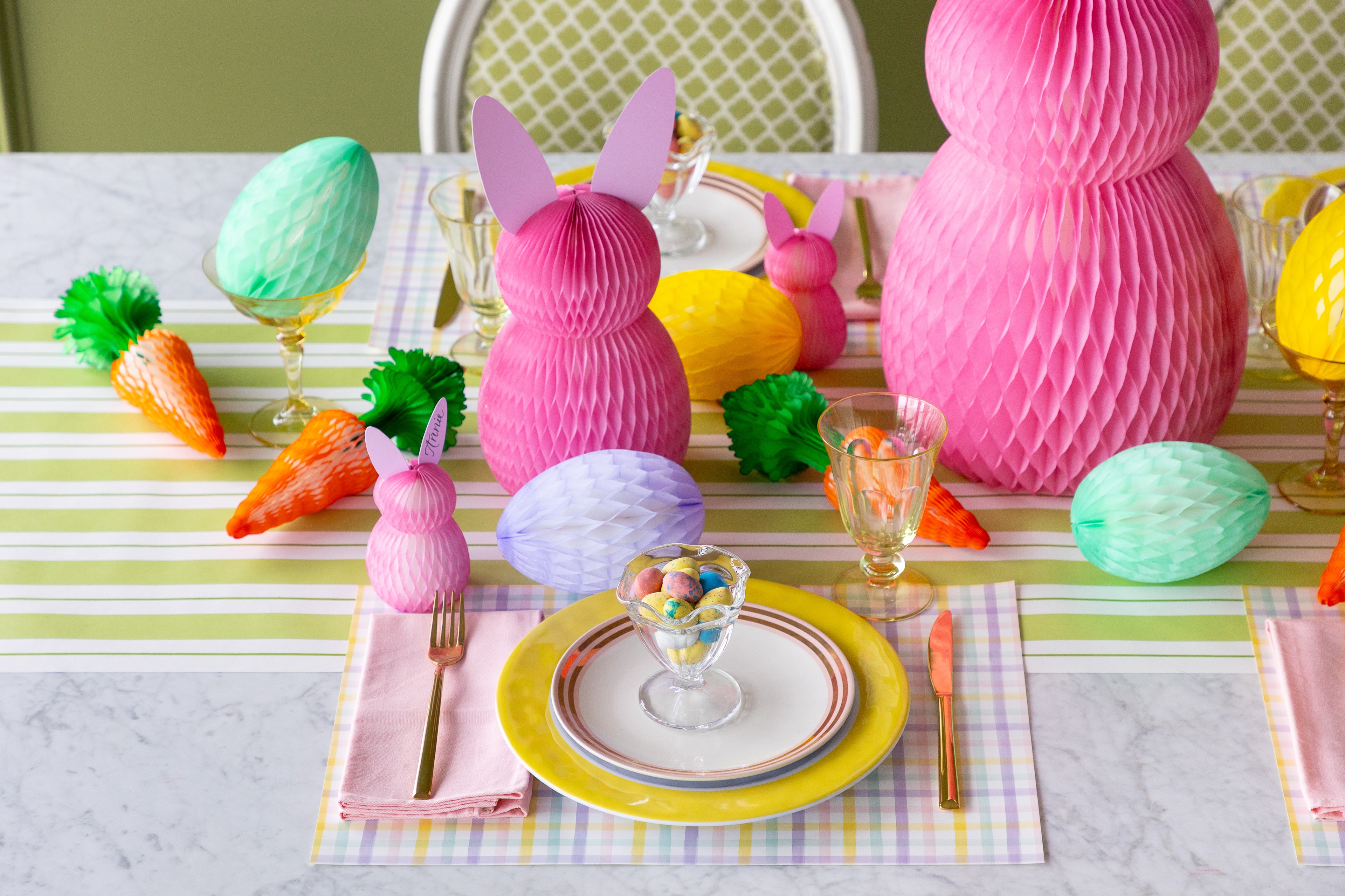 Easter-themed table setting with colorful honeycomb decorations.