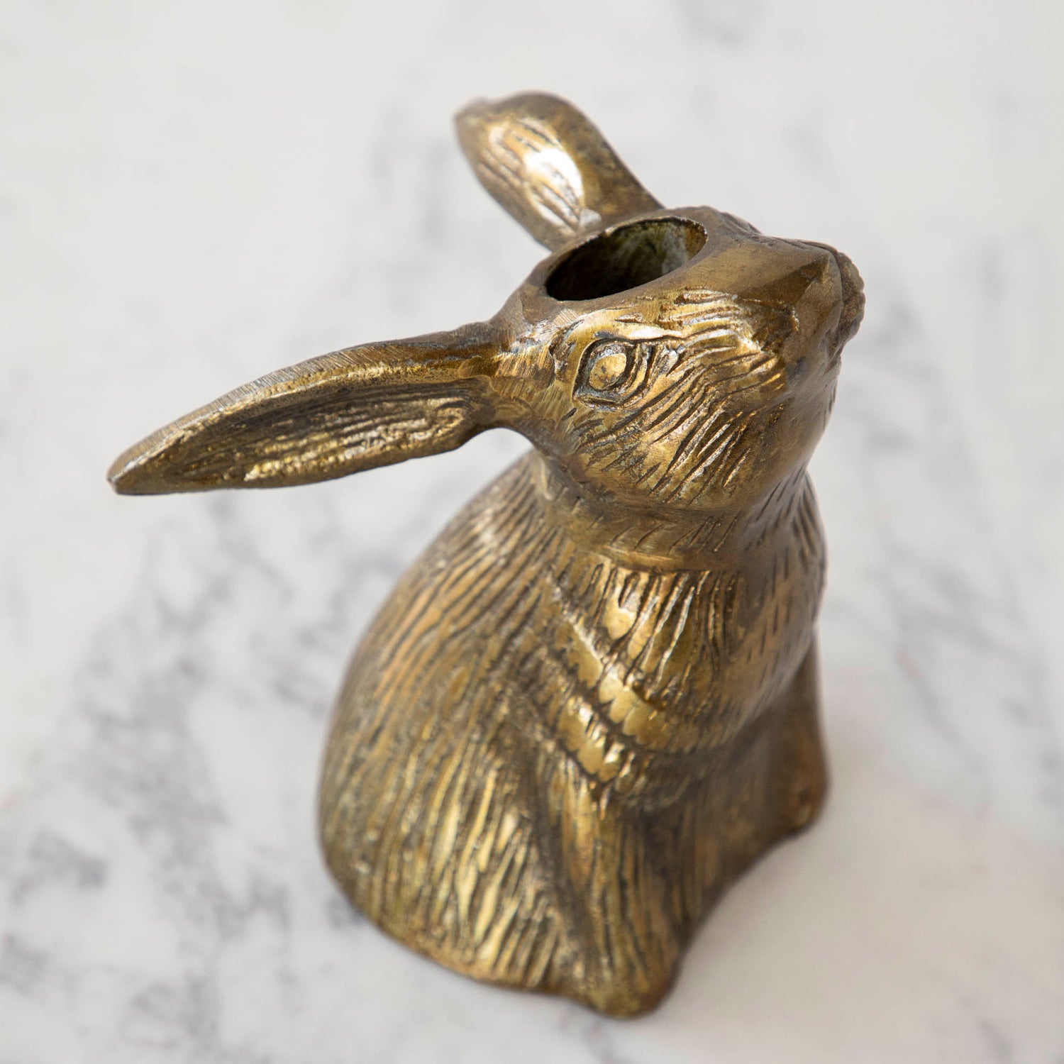 Halcyon Hare Taper Candleholders by Accent Decor on a wooden board.