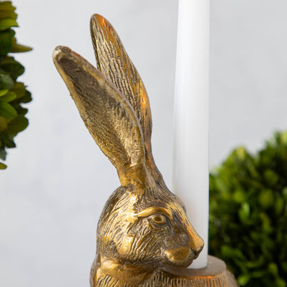 Halcyon Hare Taper Candleholders by Accent Decor on a wooden board.