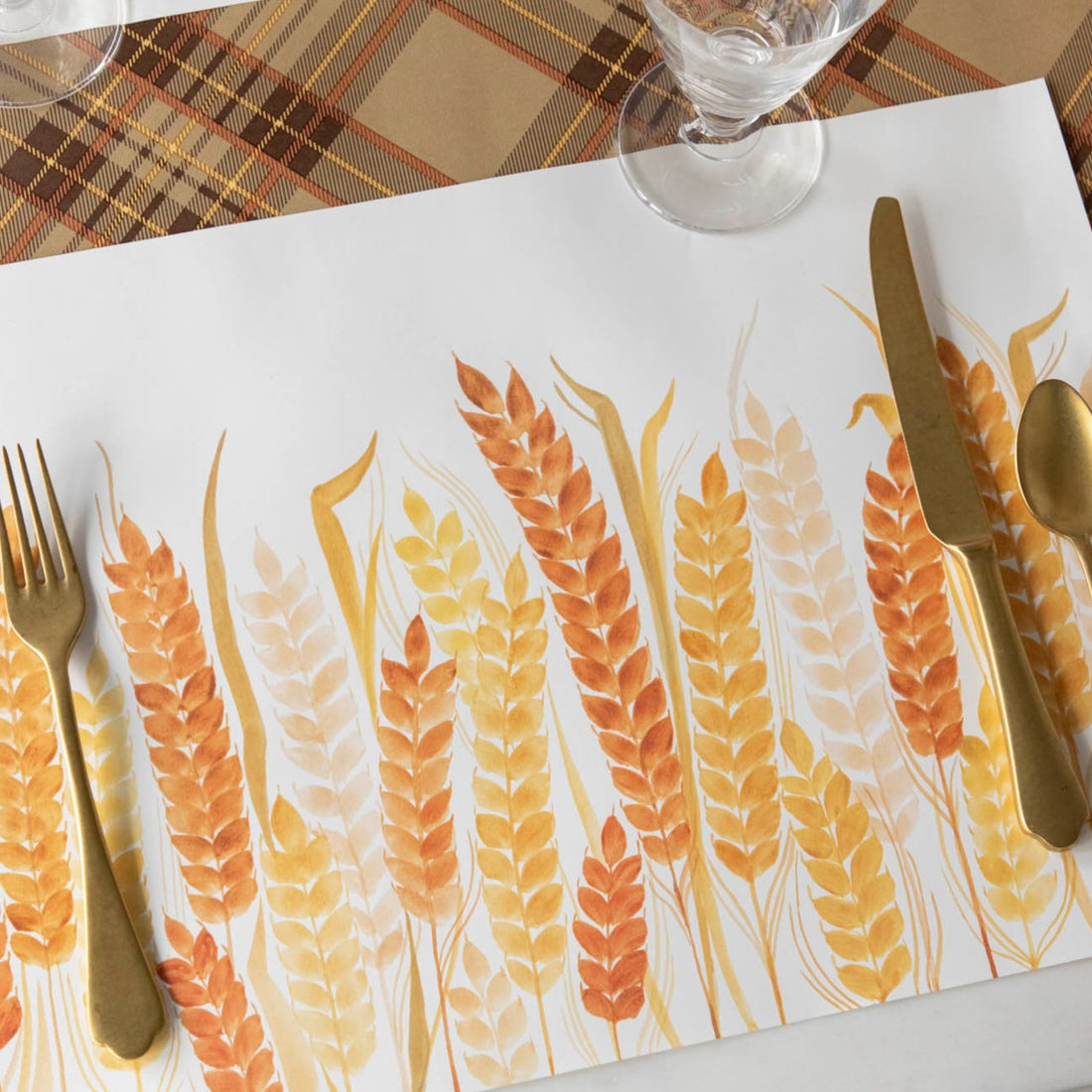 Close-up of the Golden Wheat Placemat under a fall themed place setting, sans plate.
