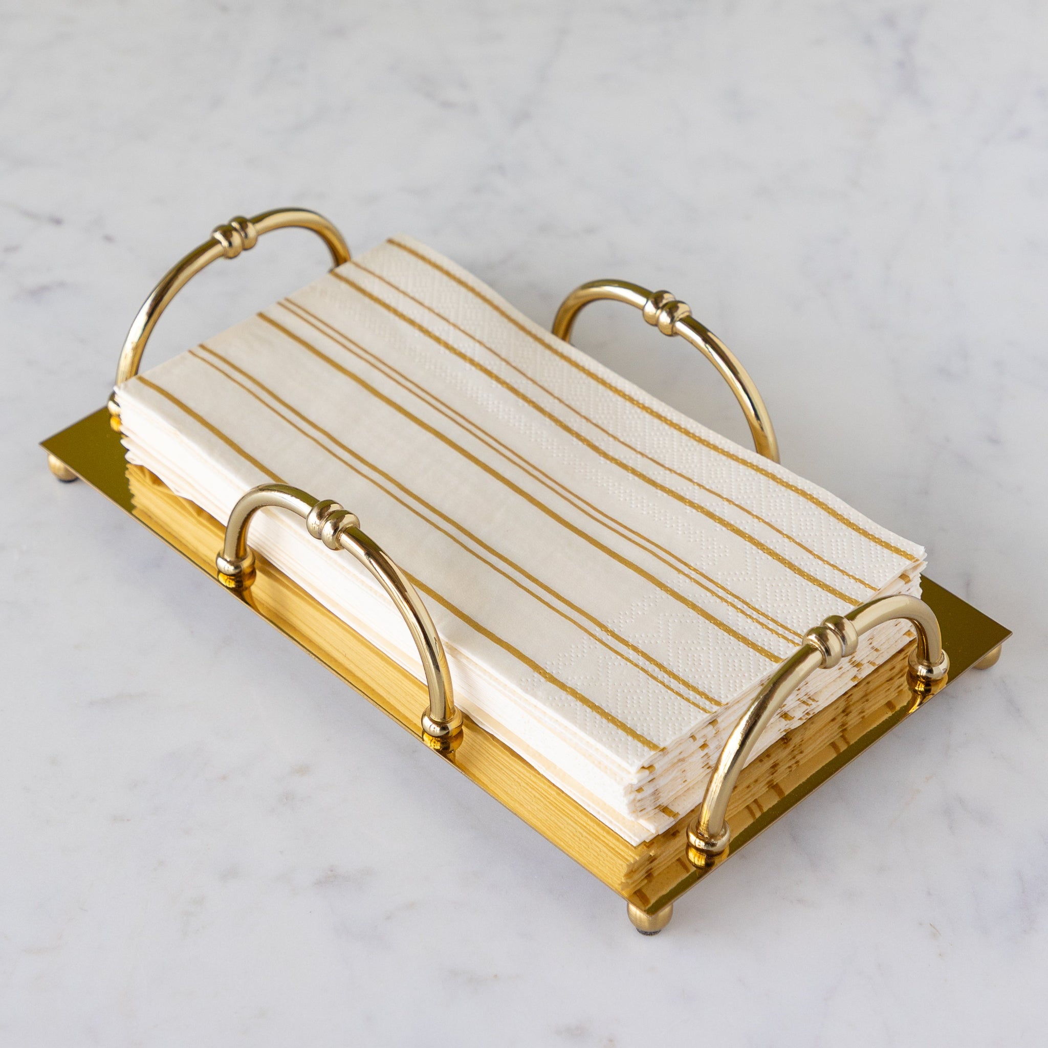Gold Scalloped Napkin Holder in the guest size with Antique Gold Stripe Guest Napkins in them.