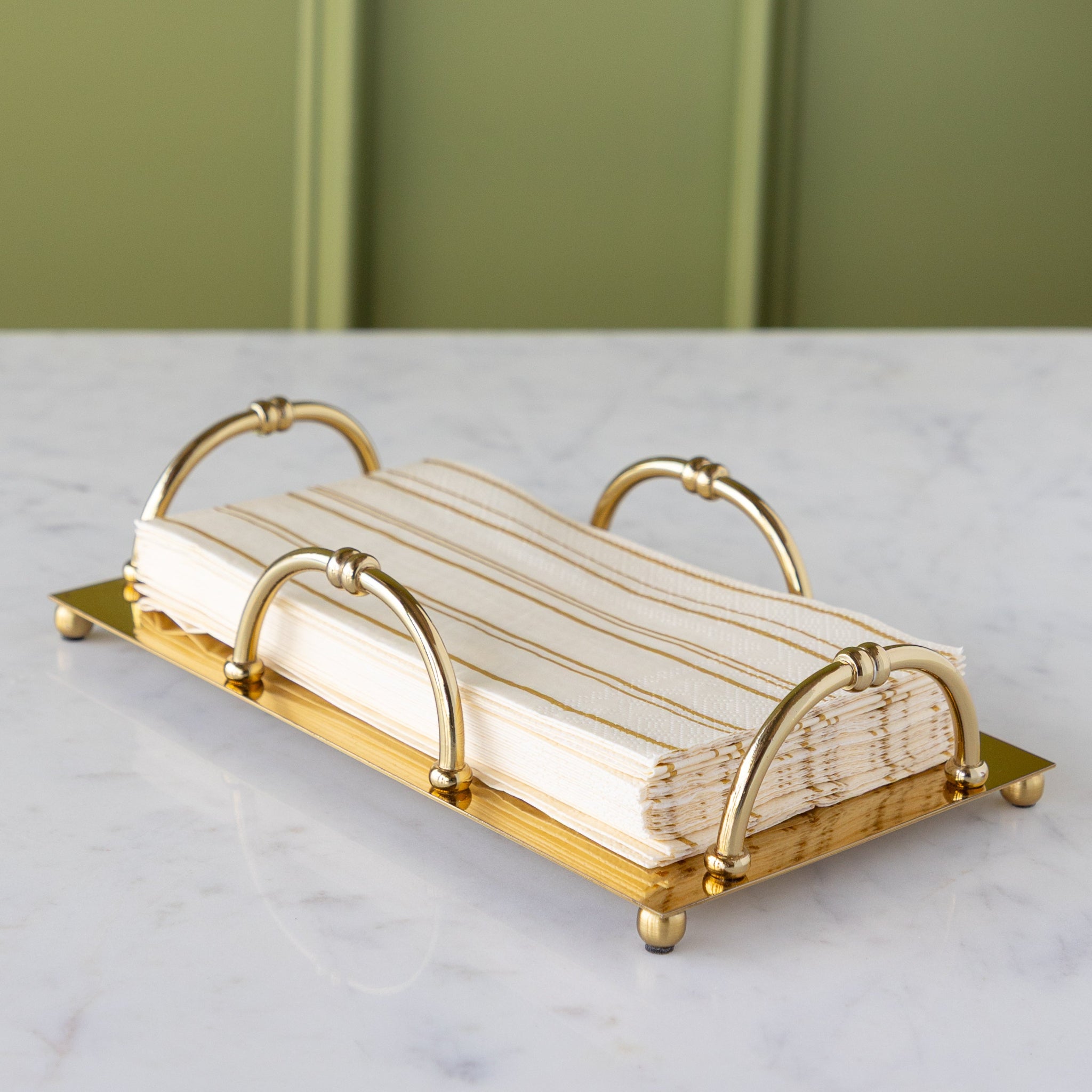 Gold Scalloped Napkin Holder in the guest size with Antique Gold Stripe Guest Napkins in them.