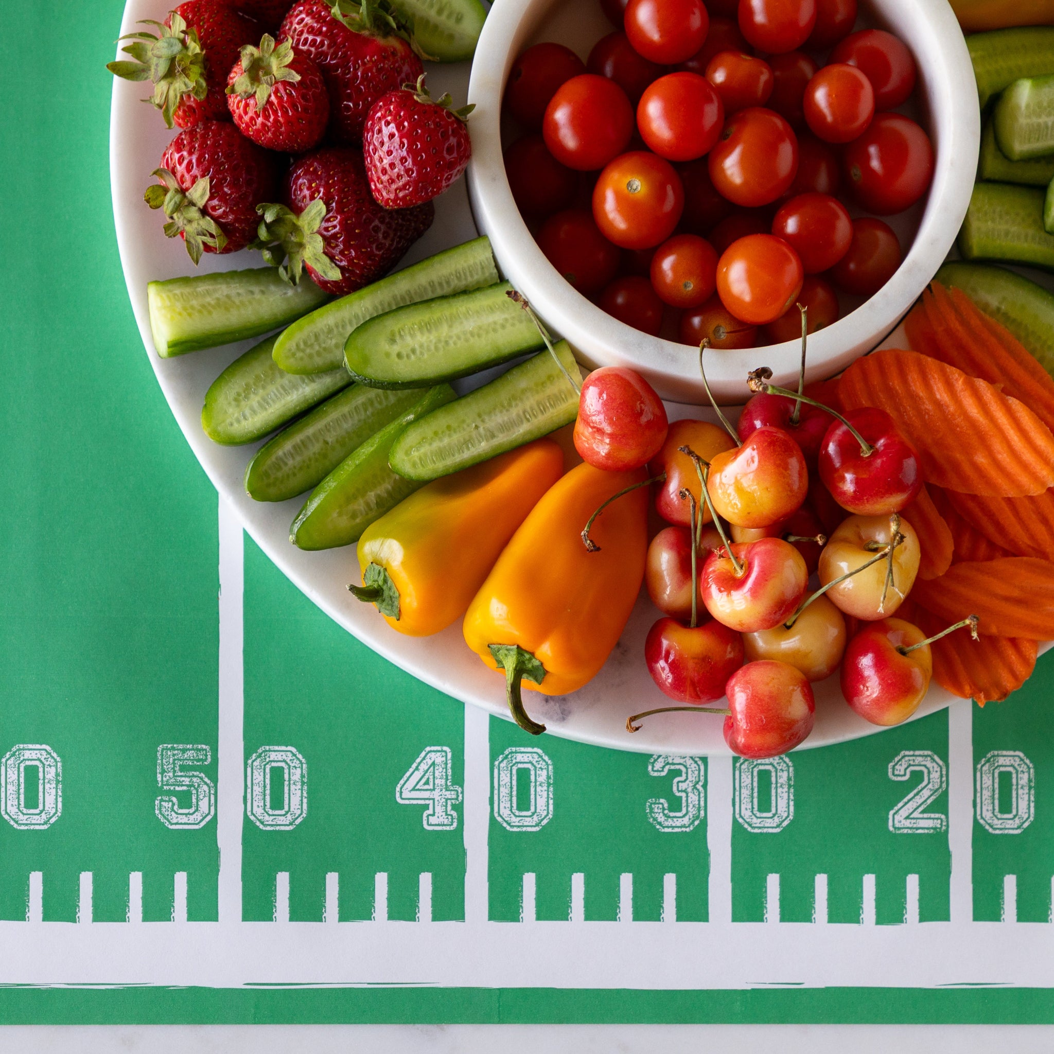 Marble Chip and Dip Server with fruits and veggies atop on the Touchdown Runner.
