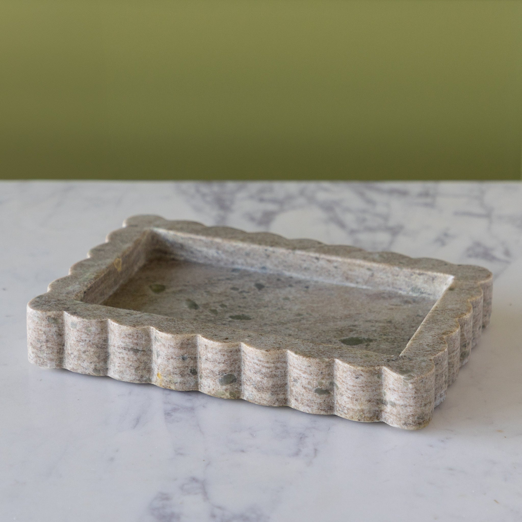Small Intricate Scallop Marble Tray on a marble surface.