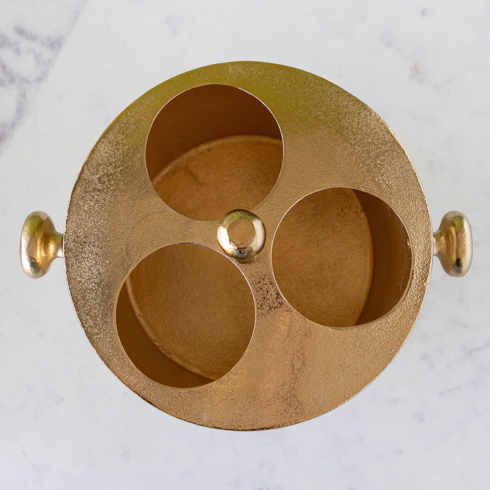 Gold Raw Aluminum Bottle Holder with three holes for wine bottles.