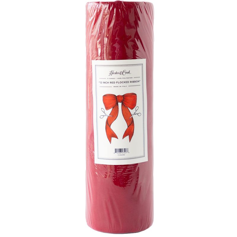 Roll of red flocked ribbon with a label on a white background