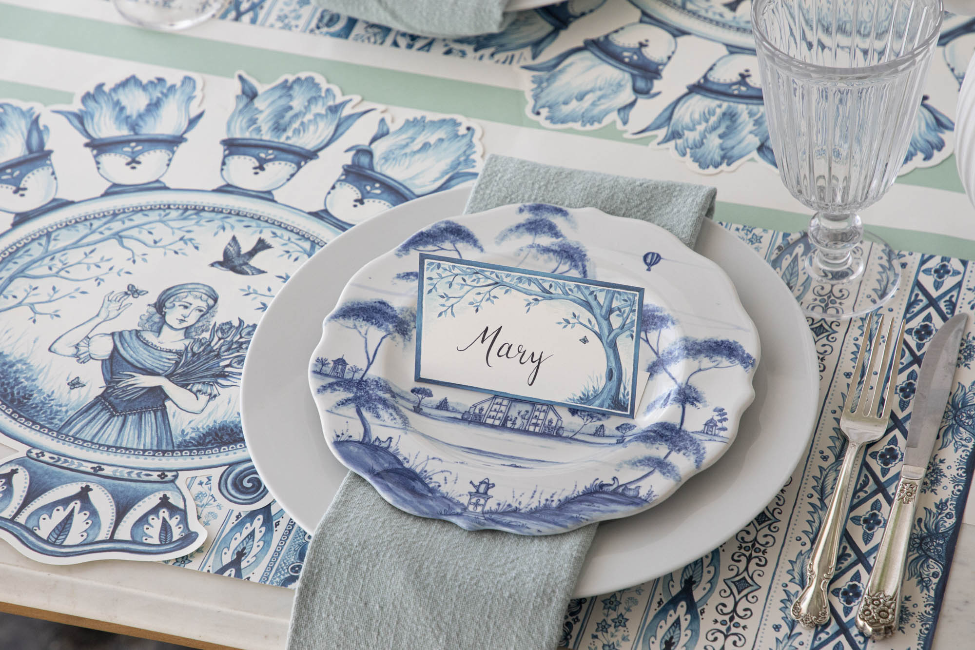 A plate adorned with Indigo Meadow Place Cards, making guests feel extra special. (Brand: Hester & Cook)
