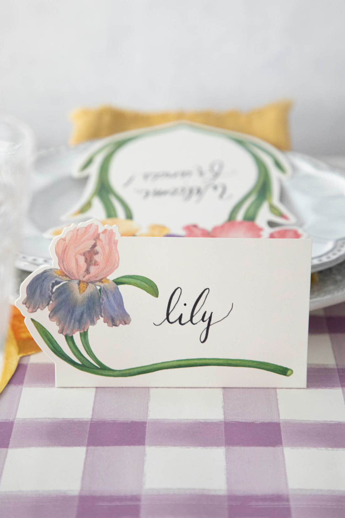 Close-up of an Iris Place Card reading &quot;Lili&quot; on an elegant springtime tablescape.