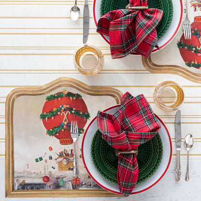The Die-cut Christmas Balloon Ride Placemat under a festive Christmas-themed table setting, from above.