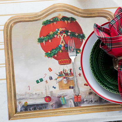 The Die-cut Christmas Balloon Ride Placemat under a festive Christmas-themed place setting.
