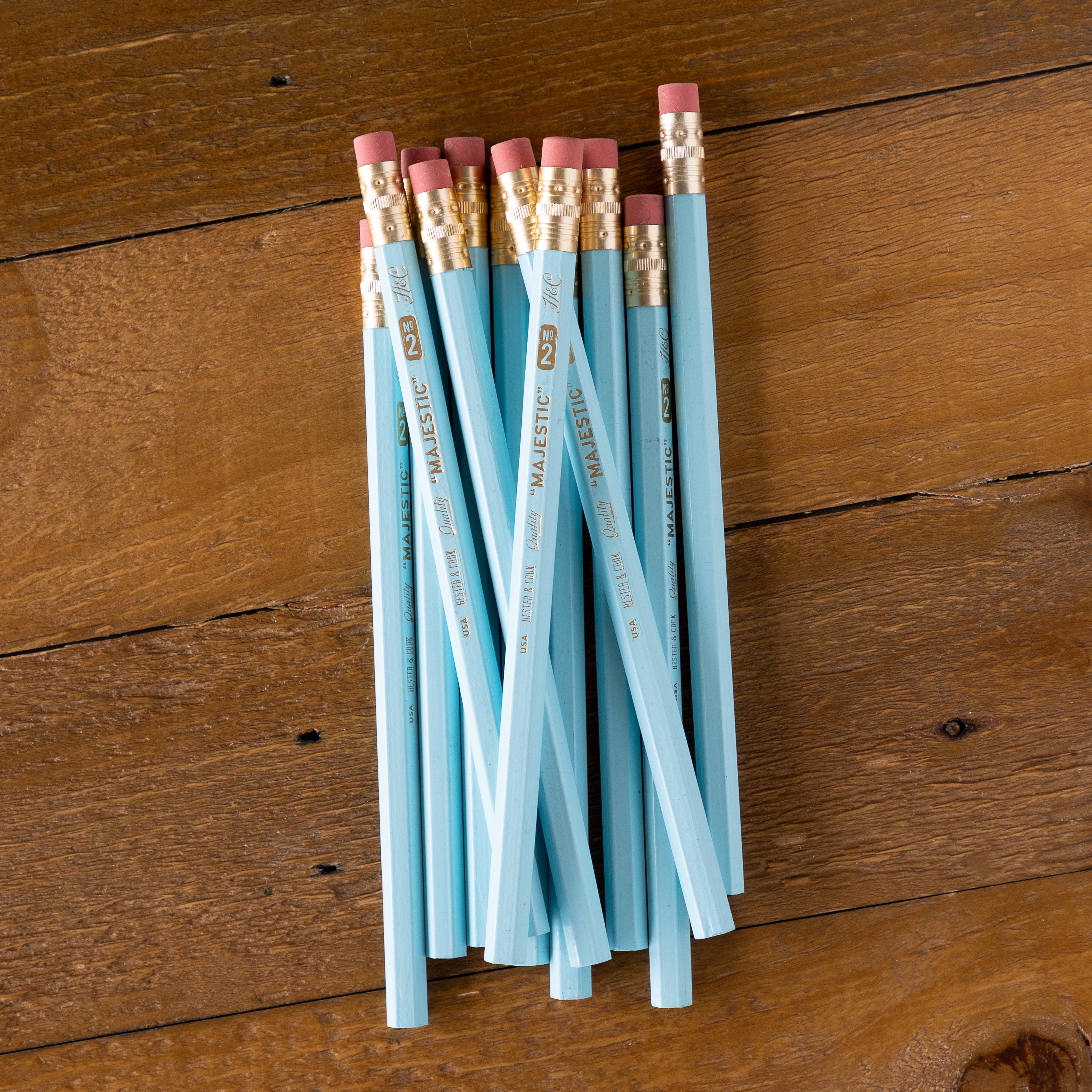 Pastel Blue Jumbo Hex Pencils grouped together on a wood background.