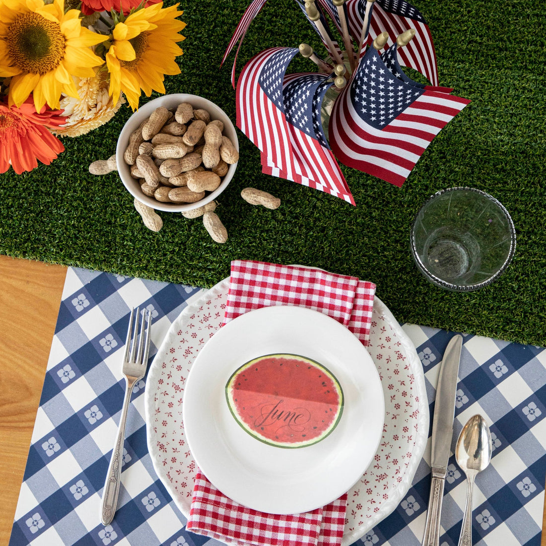 The blue Picnic Check Placemat under a patriotic-themed place setting, from above.