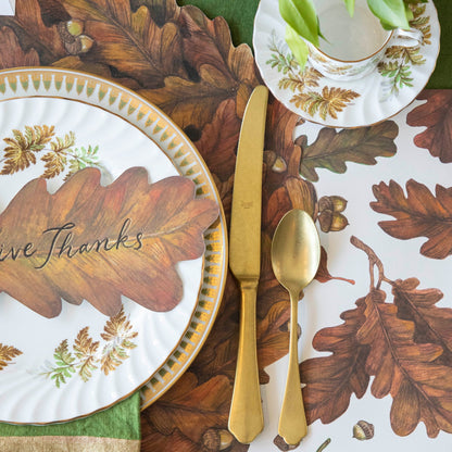 Close-up of the Die-cut Autumn Wreath Placemat under an elegant fall-themed place setting.