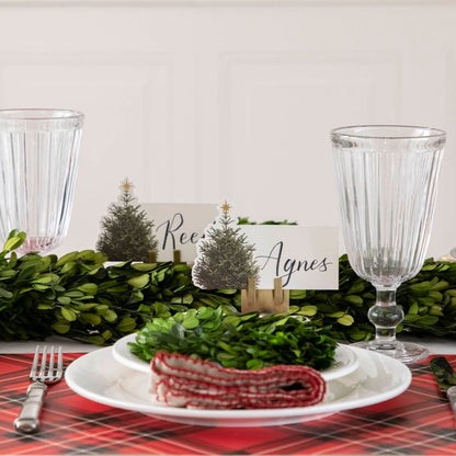 The Red Plaid Placemat under a festive holiday-themed table setting.