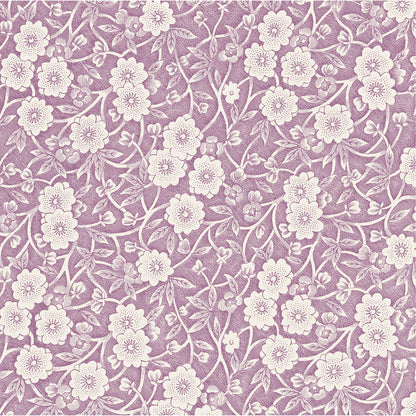 A square cocktail napkin featuring a dense pattern of white flowers, stems and leaves on a lilac purple background.