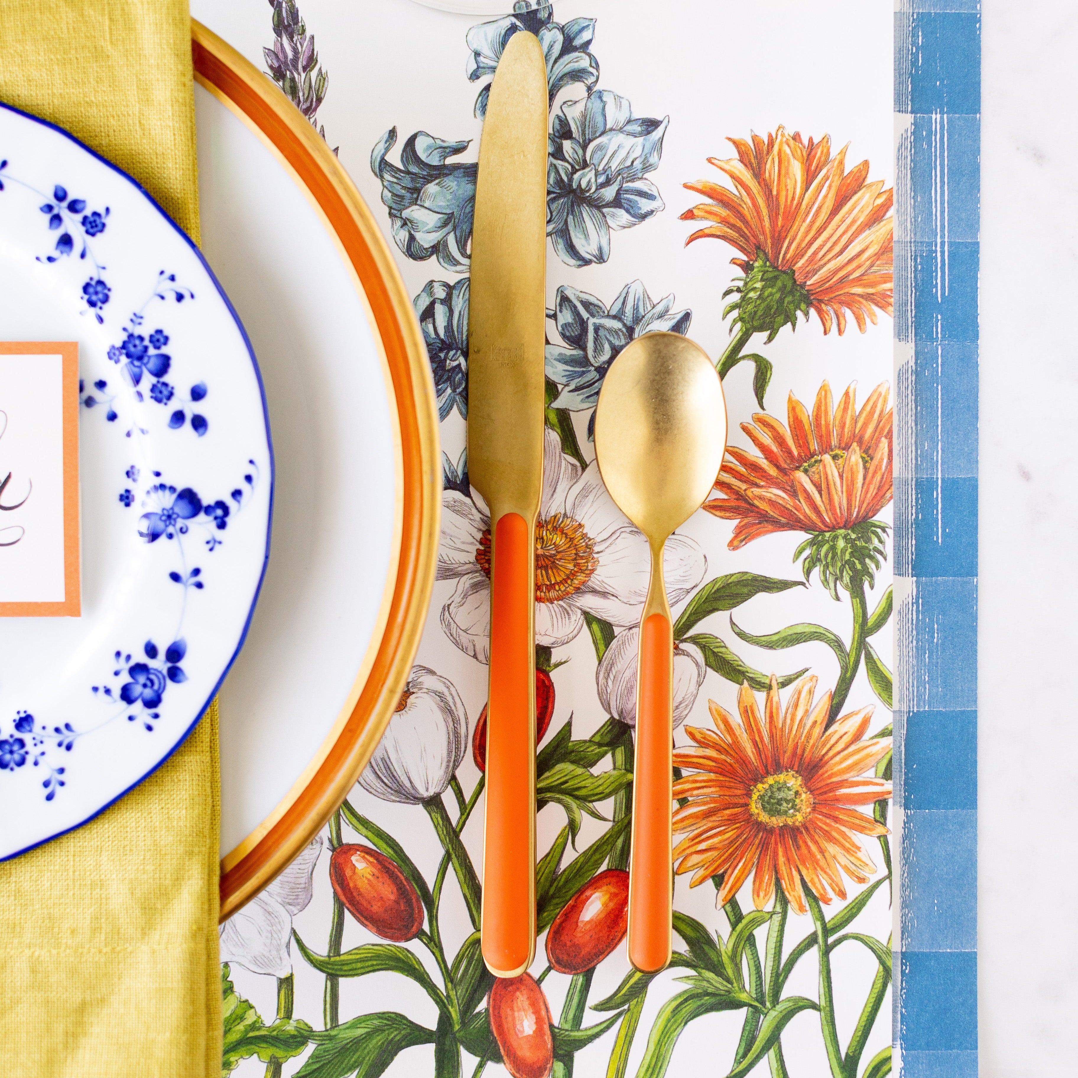 An elegant place setting with the Wildflower Meadow Placemat on the Blue Painted Check Runner.