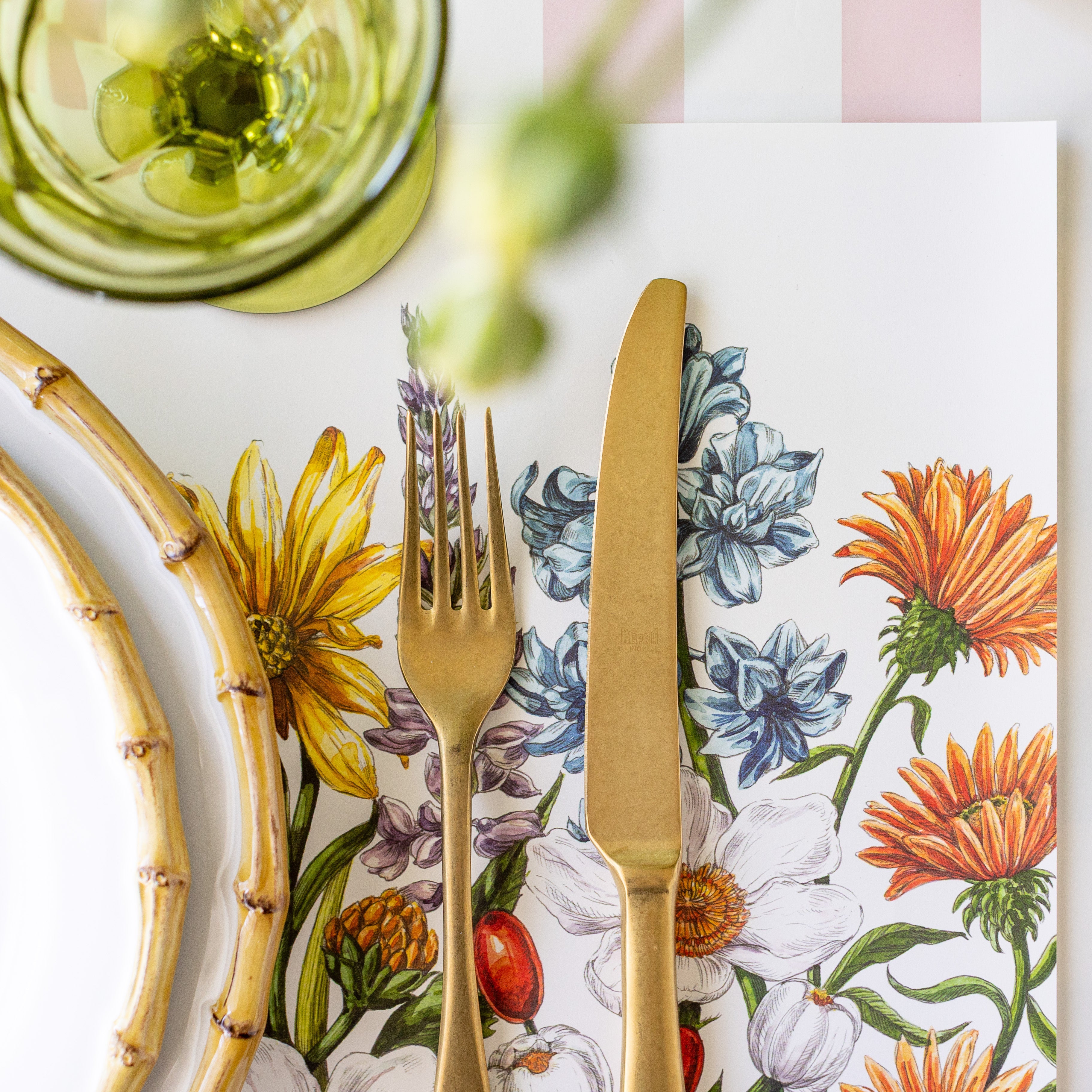 A close up of the Wildflower Meadow Placemat under Juliska Bamboo Dinnerware.