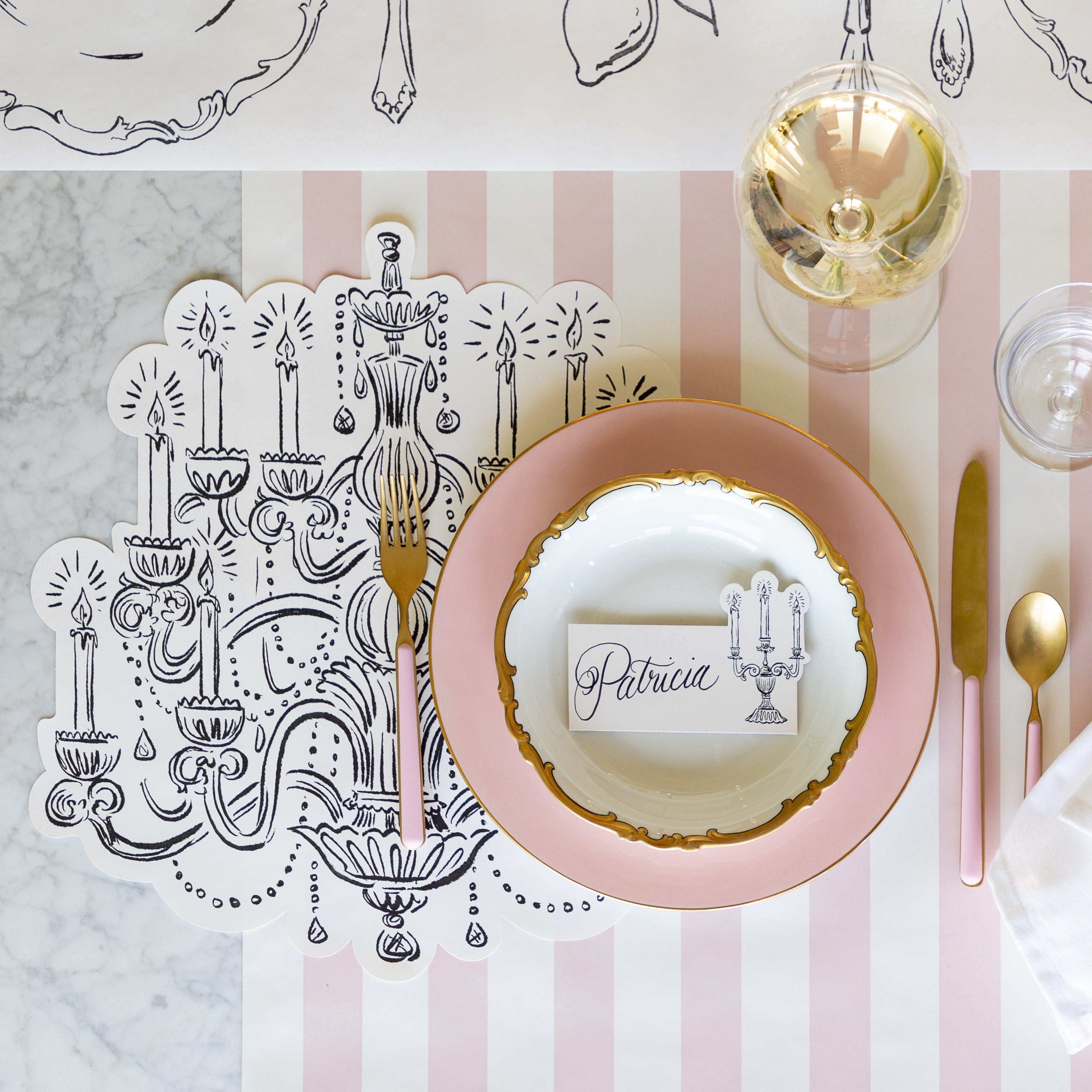An elegant place setting featuring the Die-cut Chandelier Placemat and Candelabra Place Card.