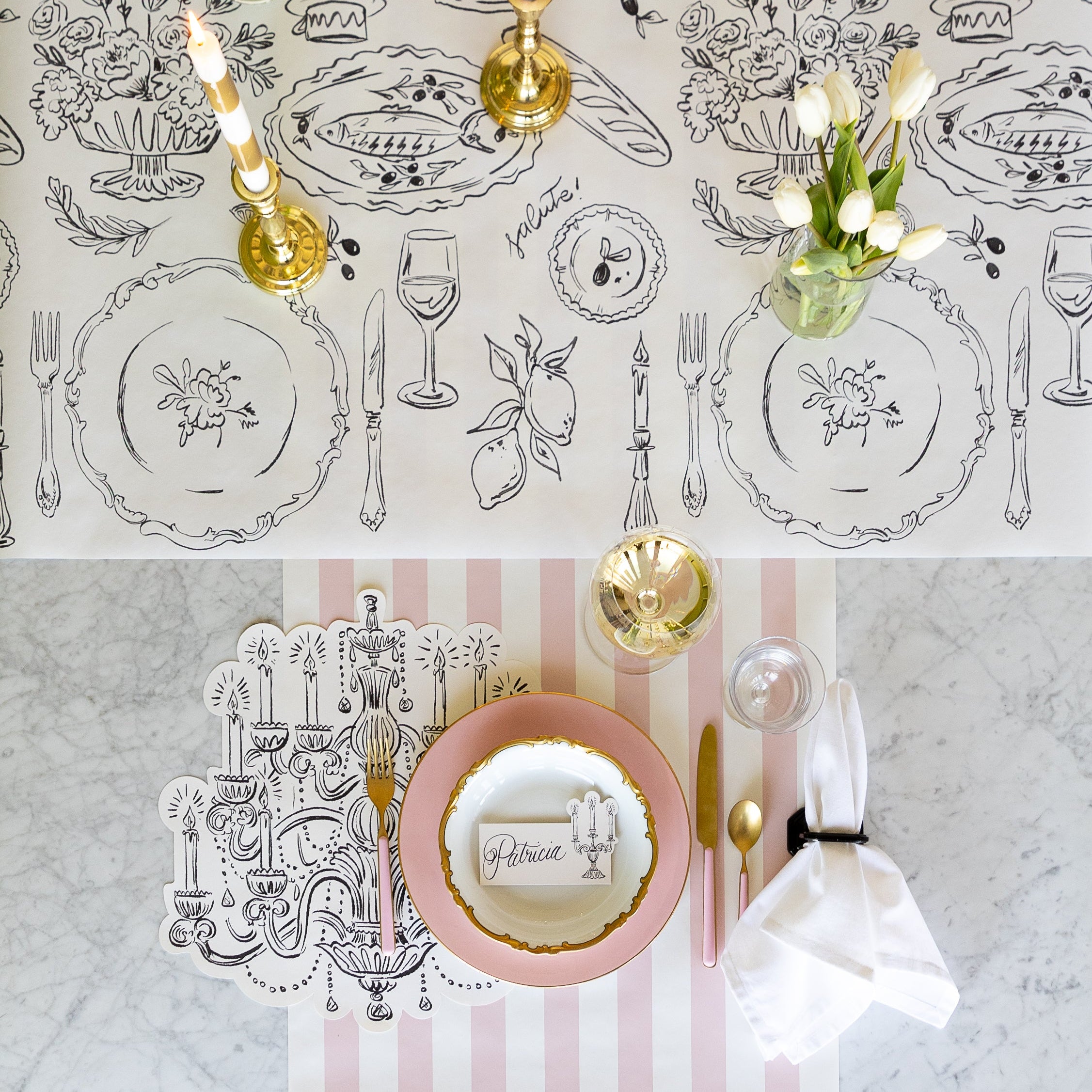 An elegant place setting featuring the Die-cut Chandelier Placemat and Dinner Party Runner.