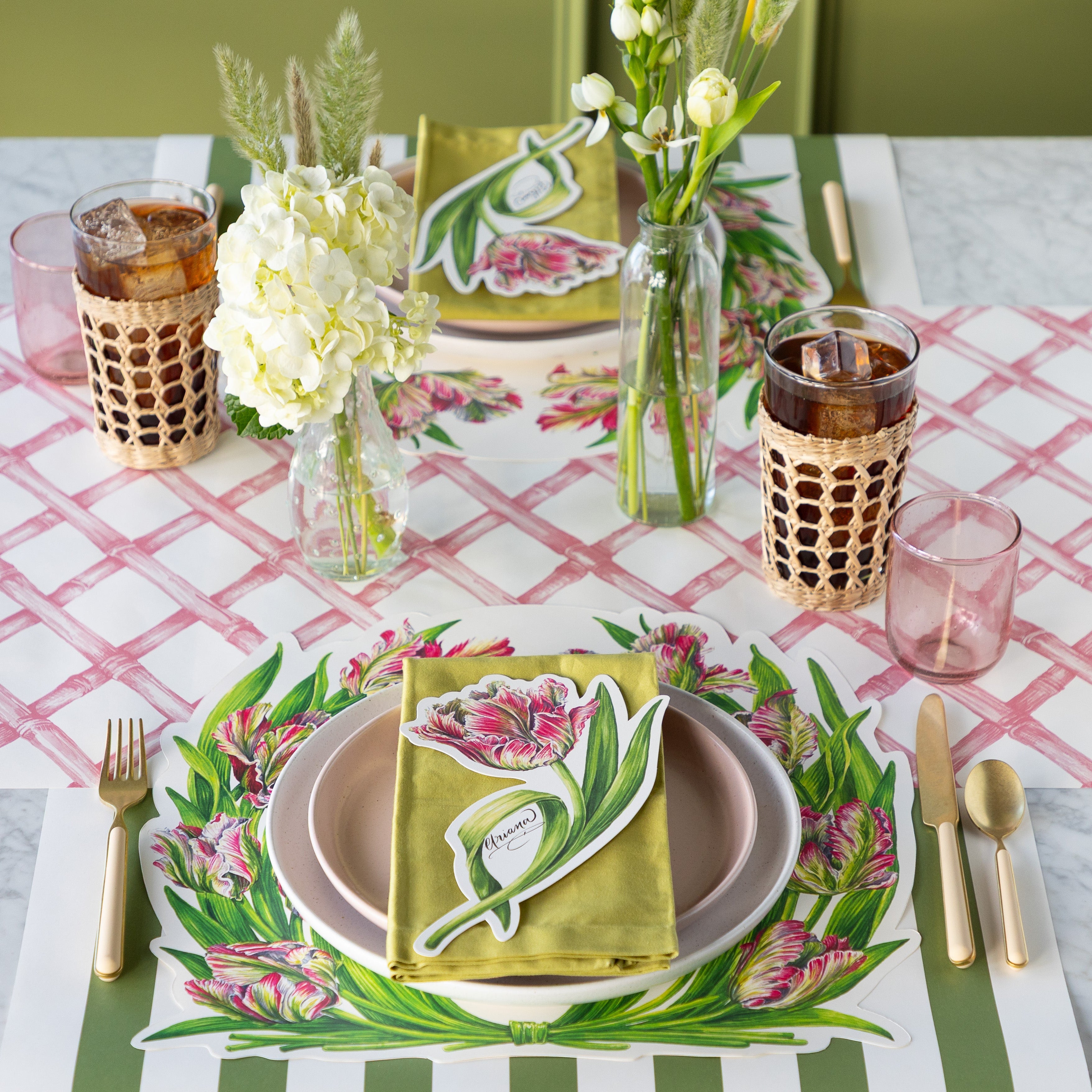 Table set with flowers, Die-cut Parrot Tulip Placemats, Parrot Tulip Table Accents, pink and white plates and vintage flatware on the Pink Lattice Runner.