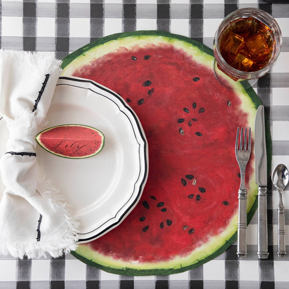 The Die-cut Watermelon Placemat under an elegant place setting, from above.