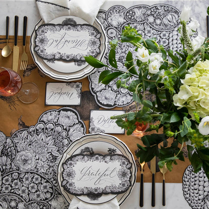 The Die-cut Ebony Harvest Turkey Placemat under an elegant Thanksgiving table setting, from above.