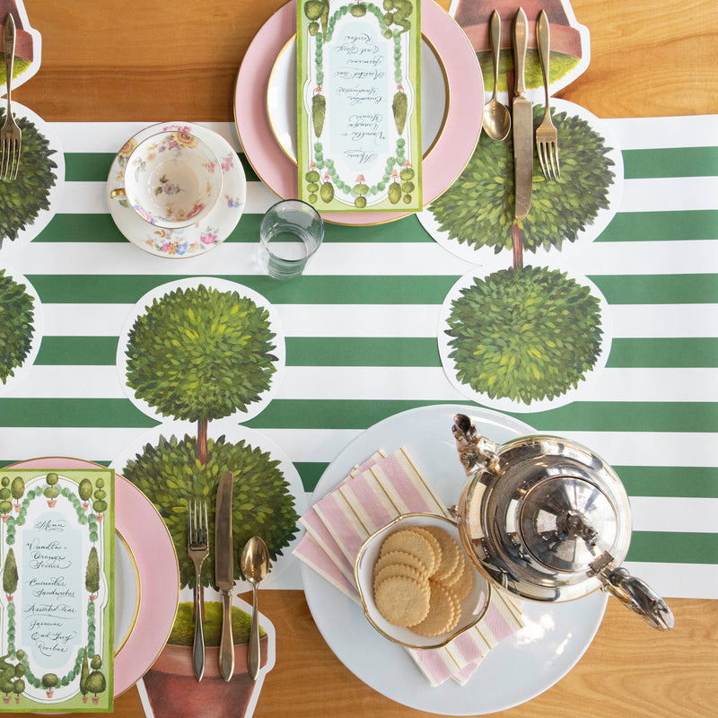 Top-down view of an elegant garden-themed tablescape, featuring Pink & Gold Awning Stripe Guest Napkins.