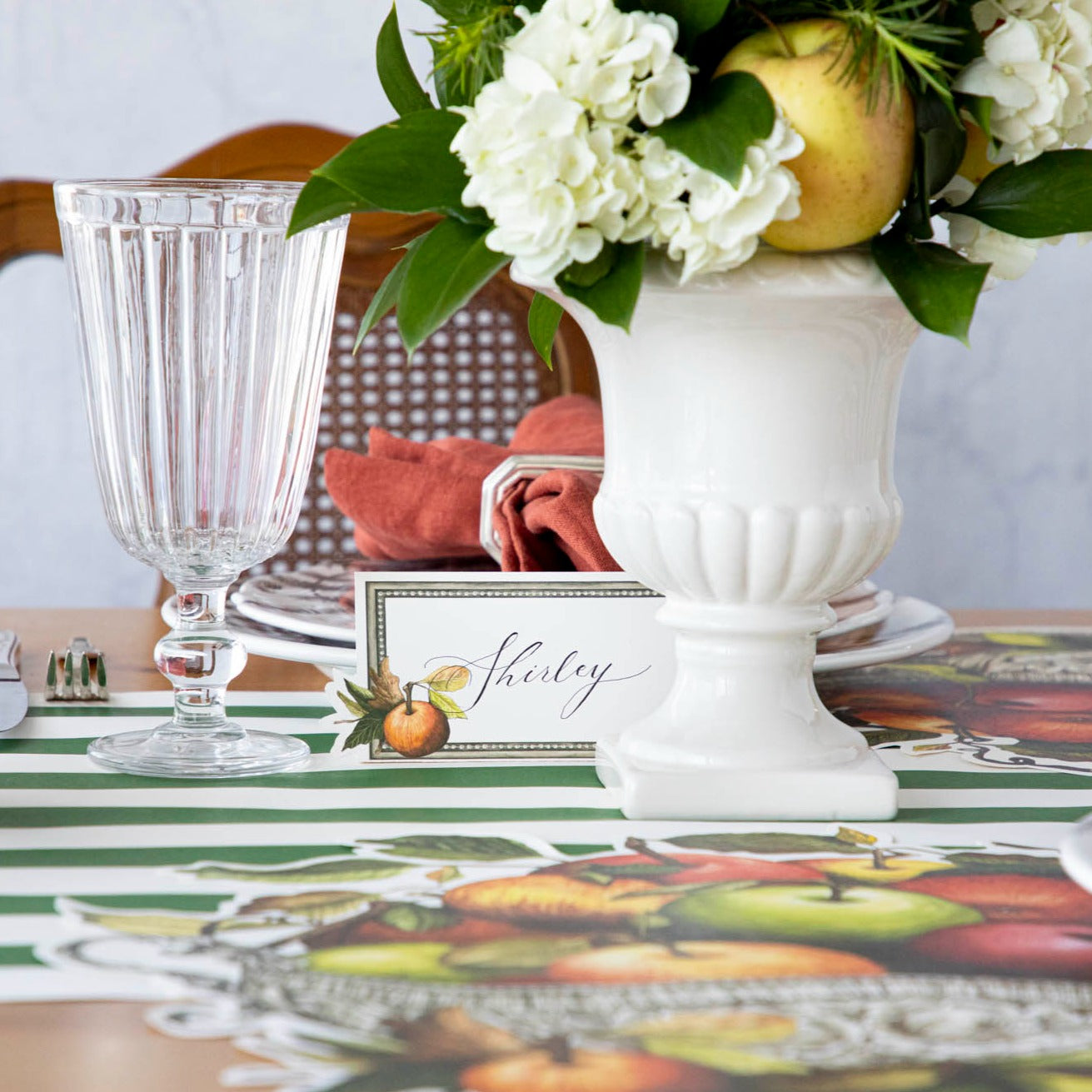 An elegant tablescape featuring Heirloom Apples Place Cards in front of each plate.