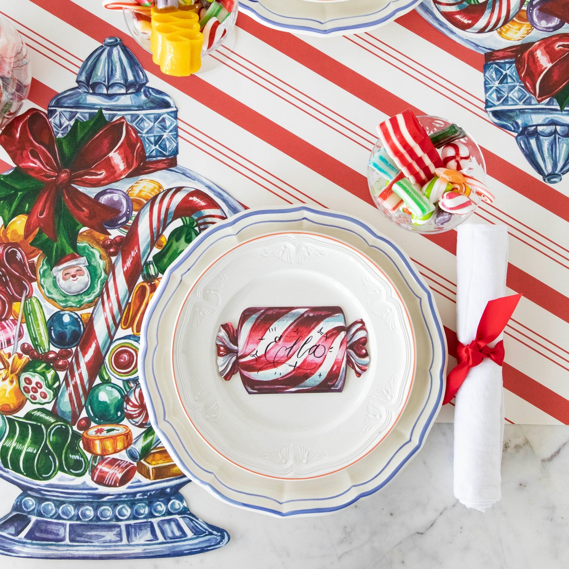 The Die-cut Candy Jar Placemat under a festive Christmas-themed place setting, from above.