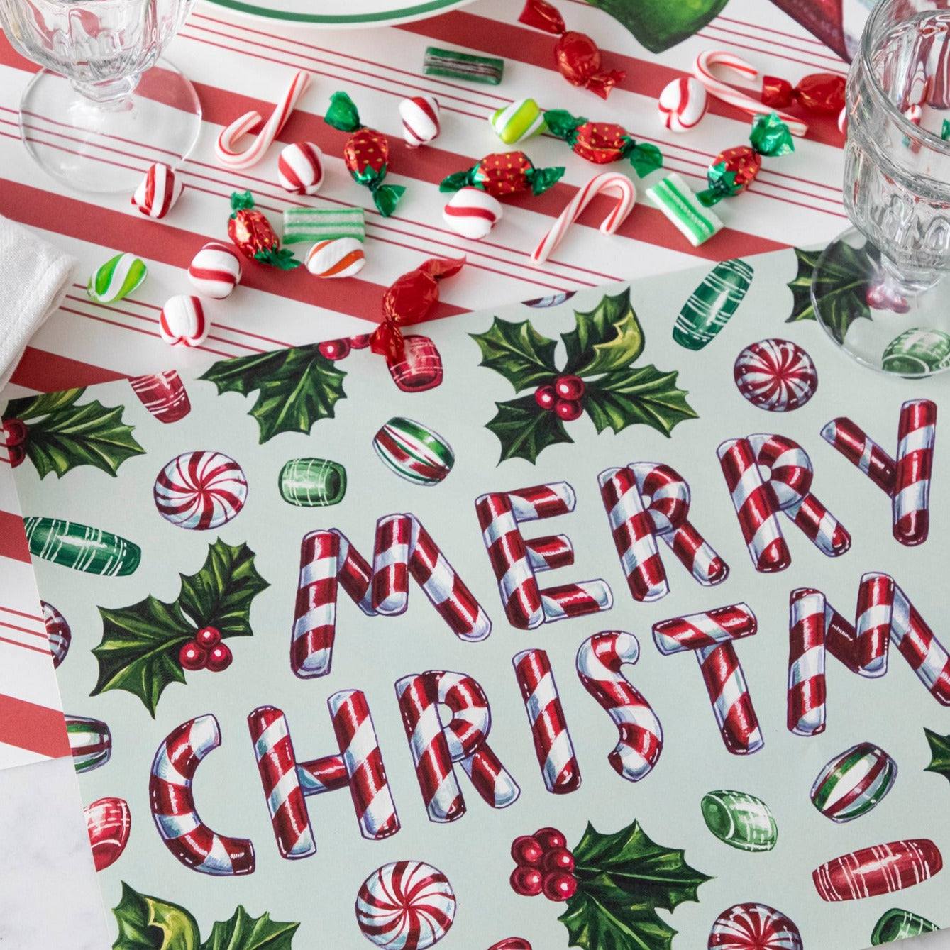 Close-up of the Merry Christmas Candy Placemat in a festive holiday place setting sans plate.