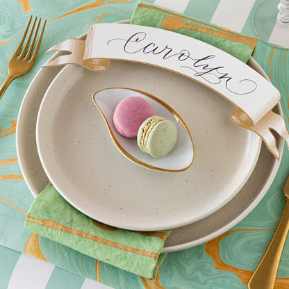 Close-up of the Seafoam &amp; Gold Vein Marbled Placemat under an elegant place setting.