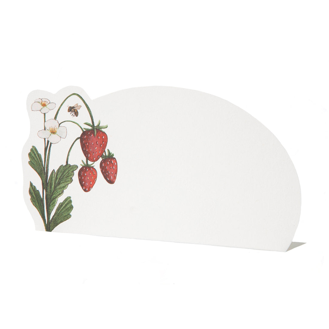 A white, die-cut freestanding place card with a rounded oval shape, featuring a strawberry plant with three red berries, two white blooms and a bee adorning the left side of the card.