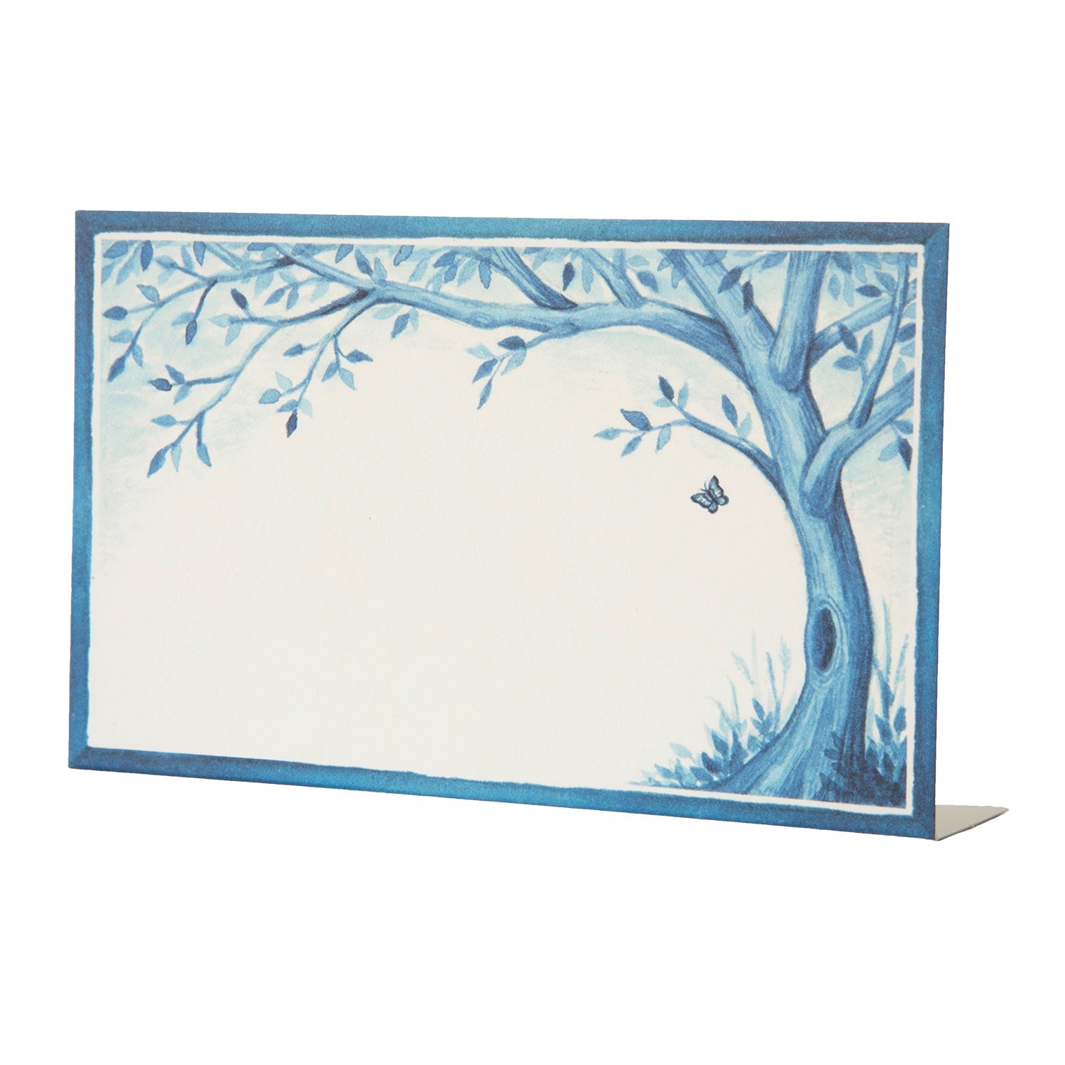 A Hester & Cook Indigo Meadow Place Card adorned with a beautiful tree and butterfly, making guests feel extra special.