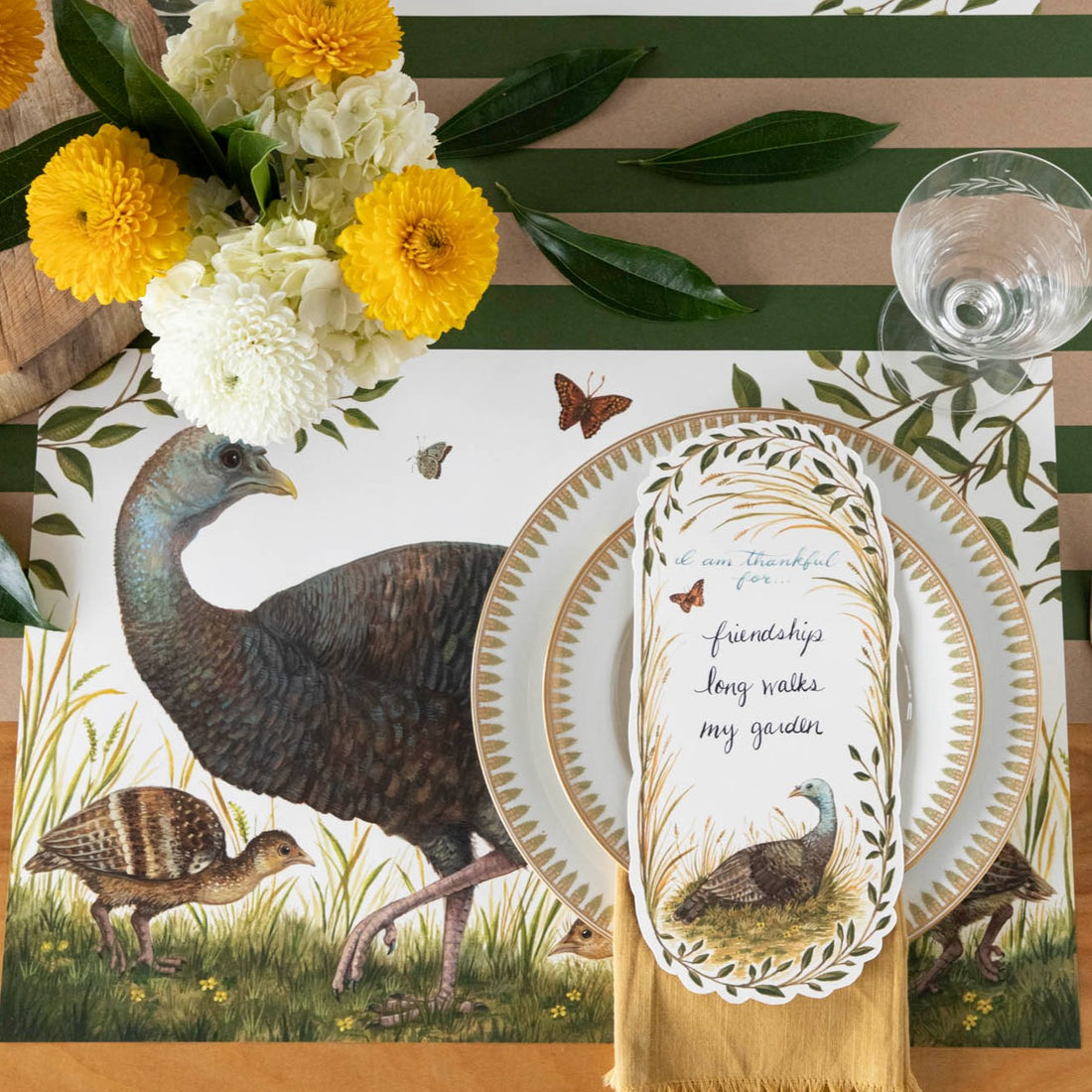 The Heritage Hen Placemat under an elegant fall-themed place setting, from above. 