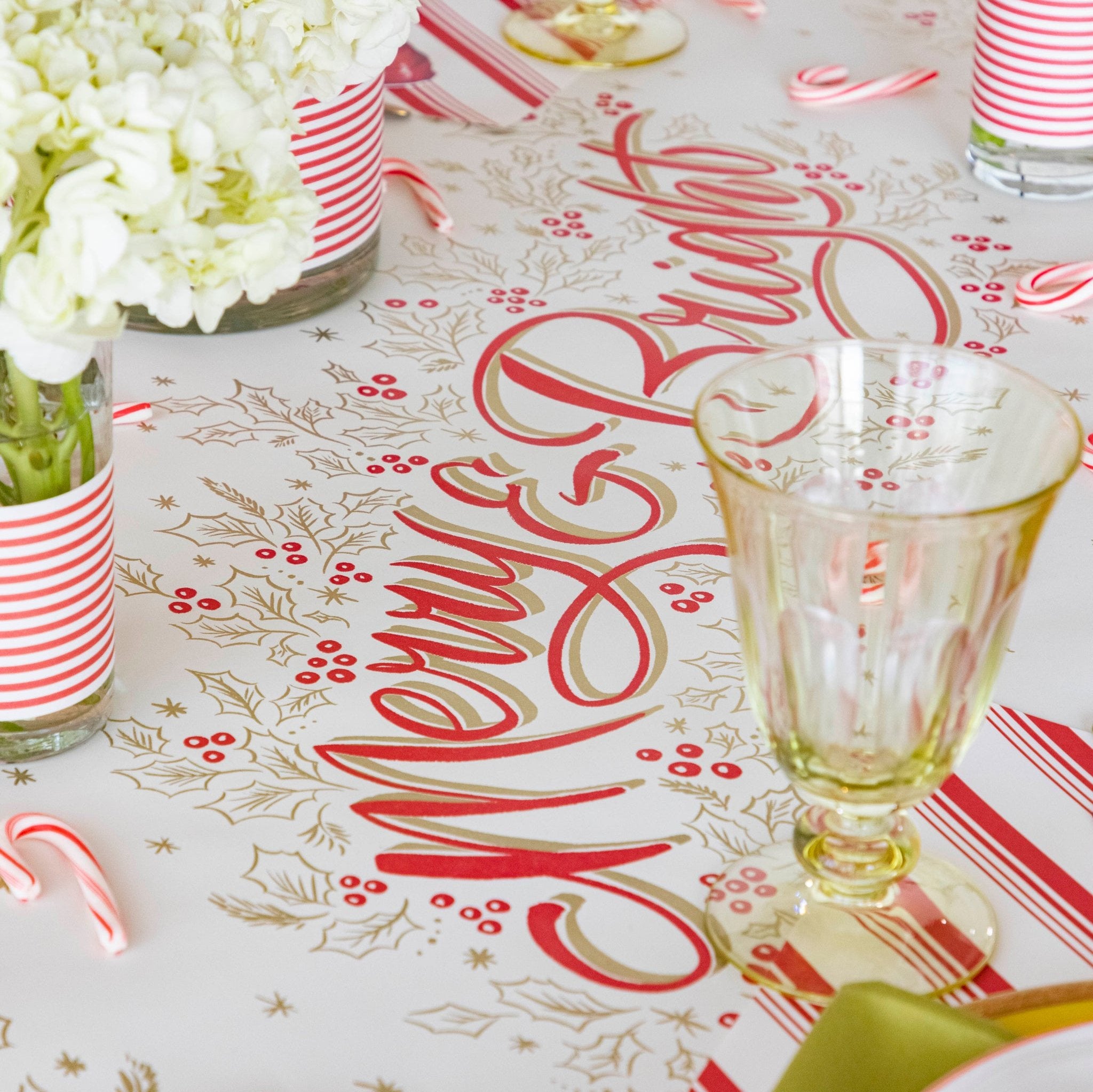 The Merry & Bright Runner on a festive table setting with flowers and candy canes.
