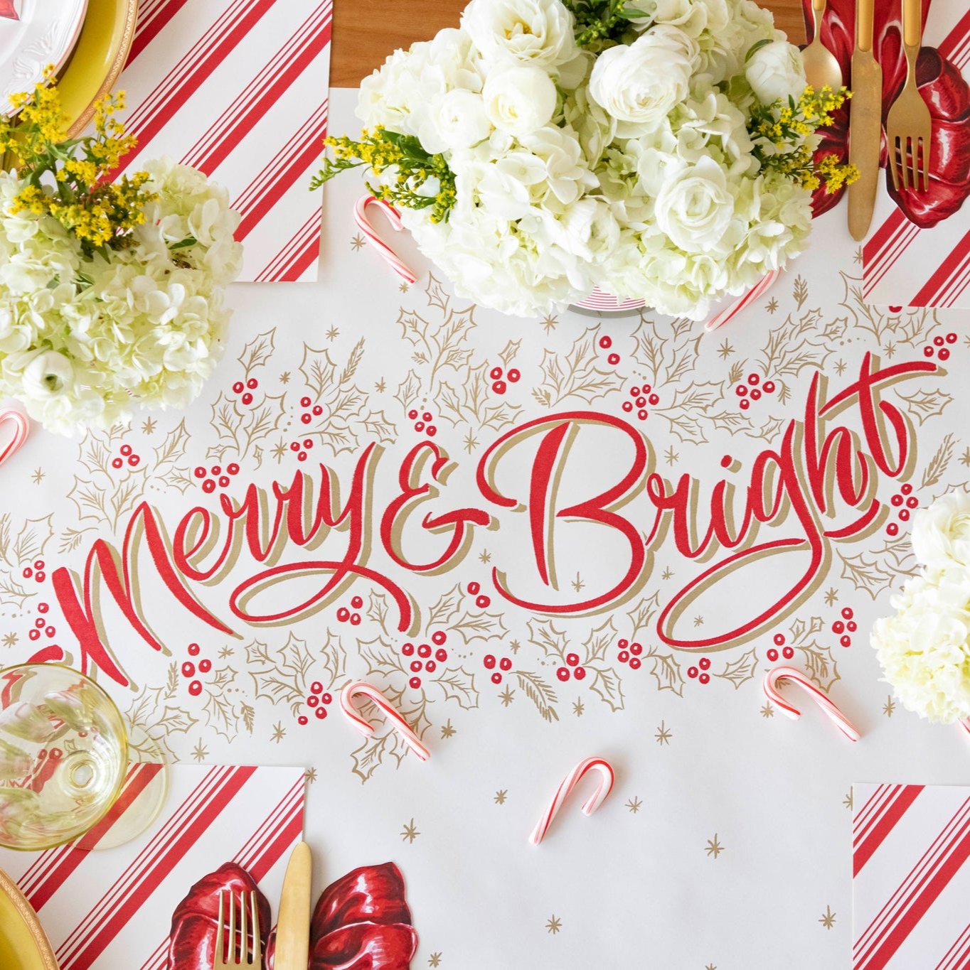 The Merry & Bright Runner styled on a festive table setting with candy canes sprinkled across the runner.