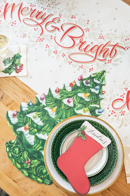 The Die-cut Vintage Christmas Tree Placemat under an elegant holiday place setting.