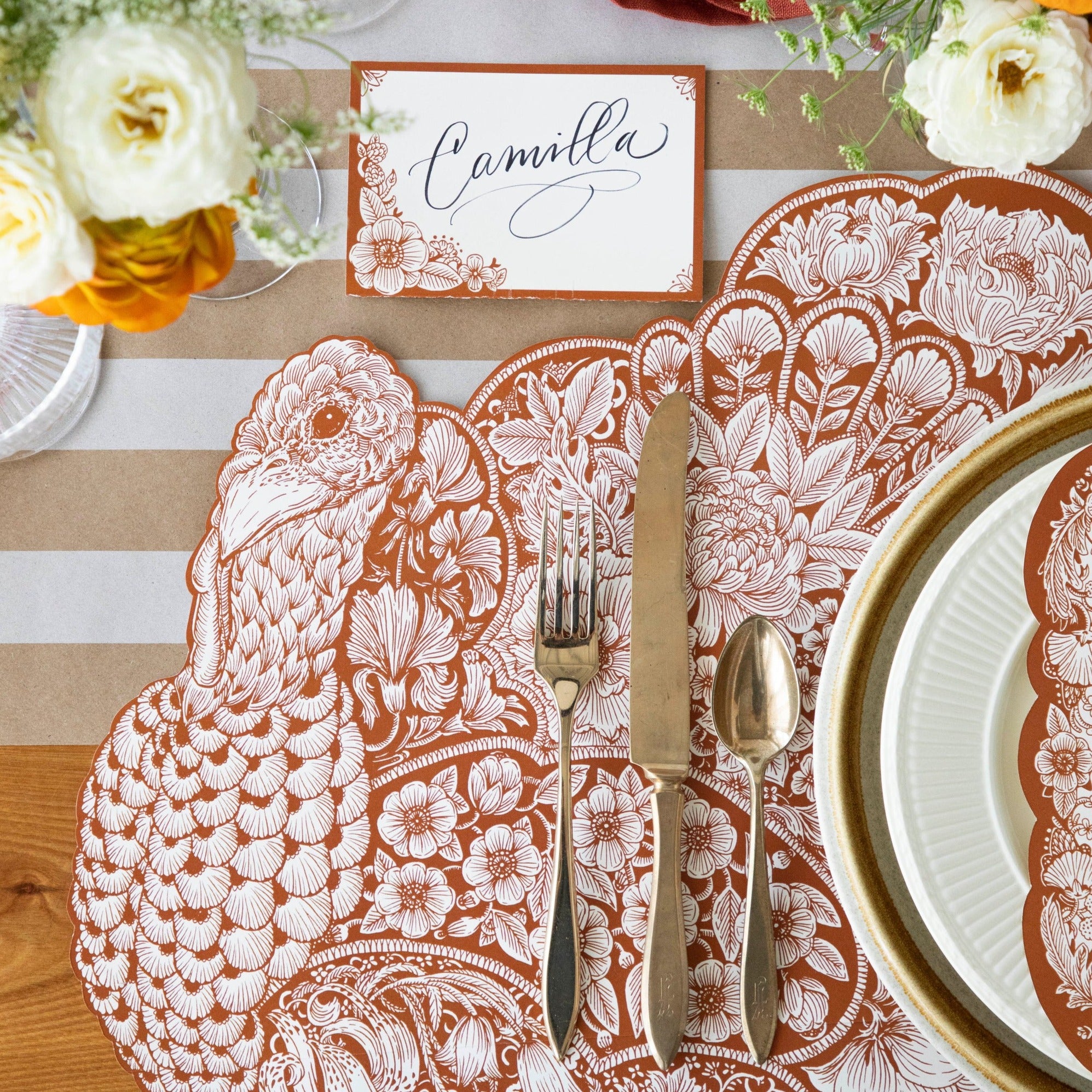 Close-up of the Die-cut Harvest Turkey Placemat under an elegant Thanksgiving place setting, showing the detailed artwork.