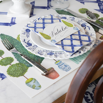 The Topiary Garden Placemat in an elegant place setting.
