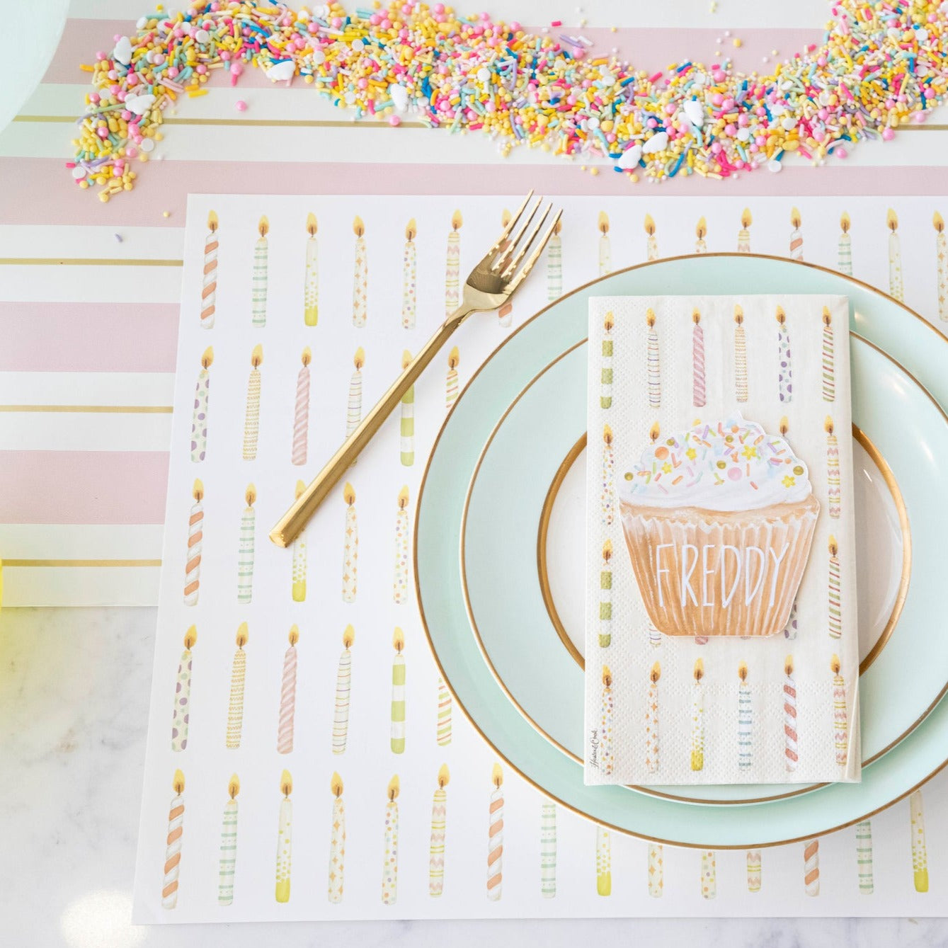 The Pink &amp; Gold Awning Stripe Runner under an elegant birthday place setting.