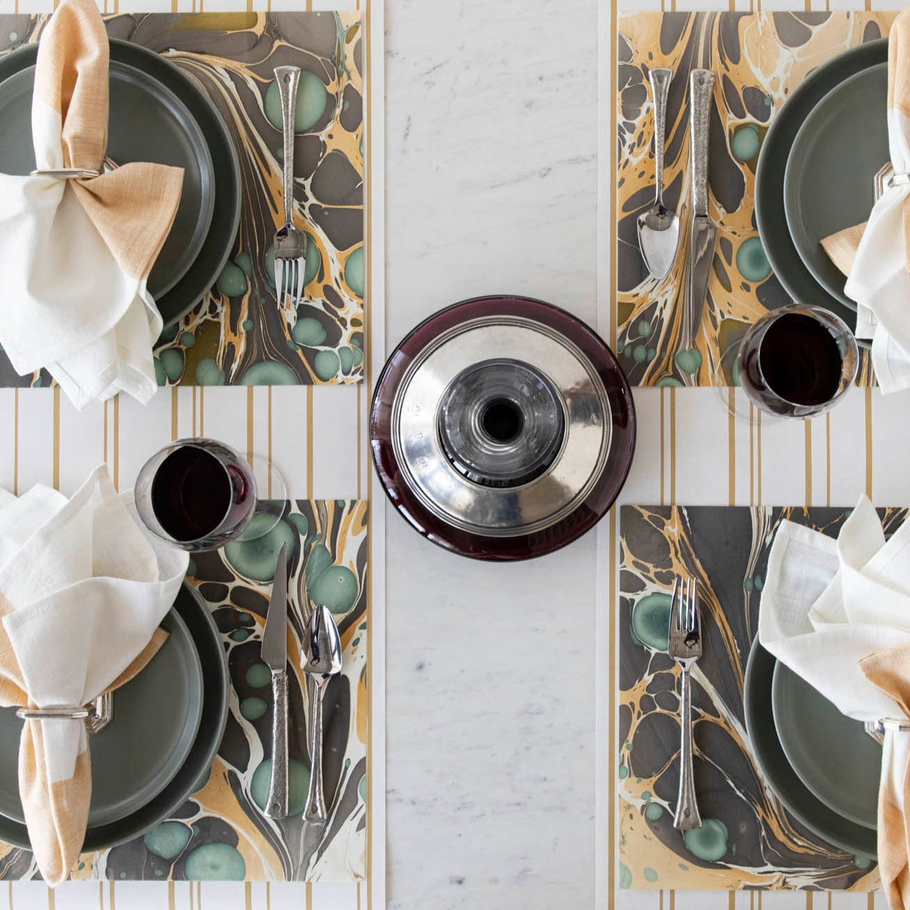 Over-head view of the Brown Stone Marbled Placemat under an elegant table setting for four.