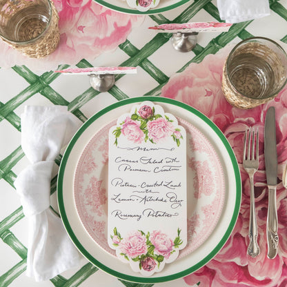 The Die-cut Peony Placemat under an elegant floral place setting, from above.