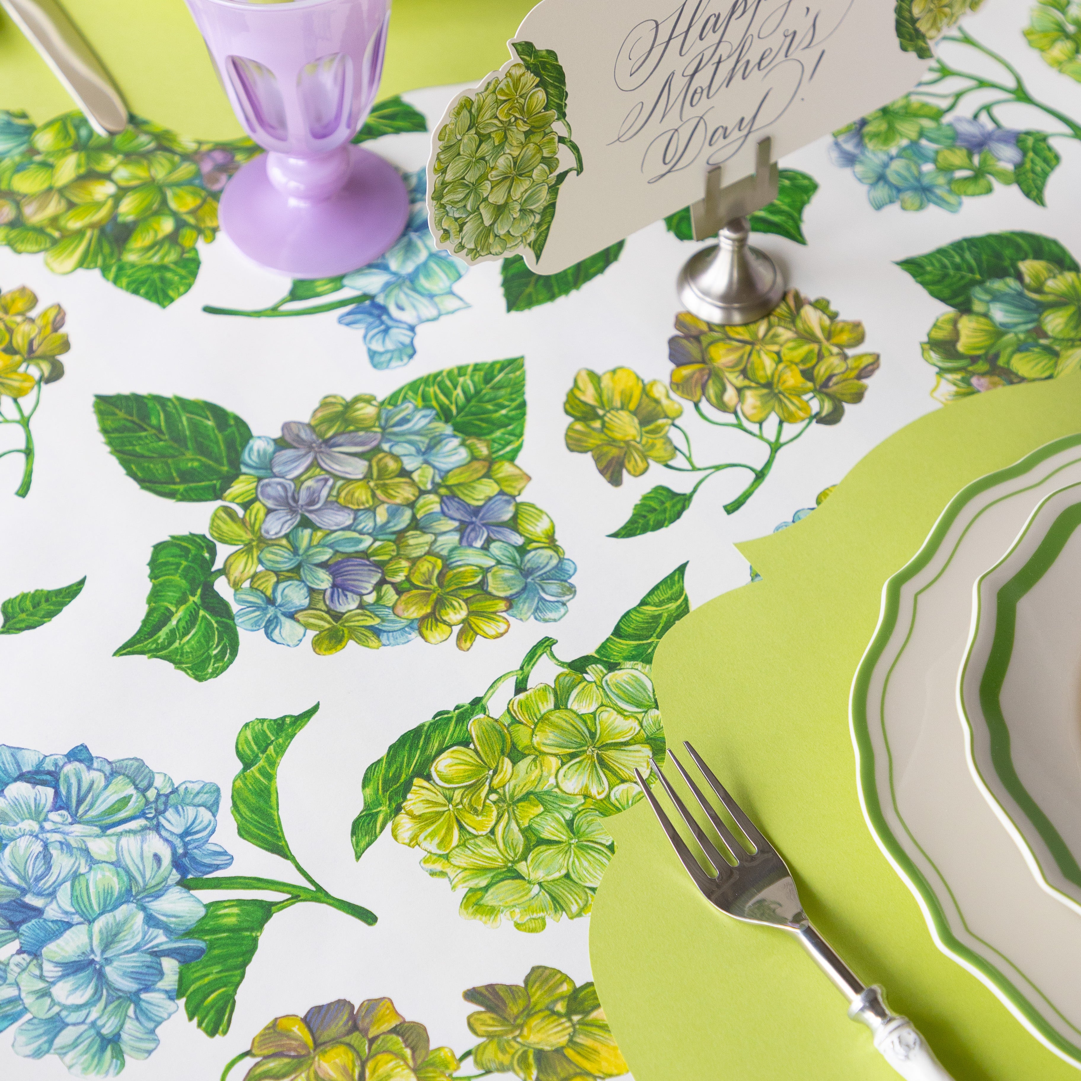 Decorative table setting with Hydrangea Runner, cutlery, and a &