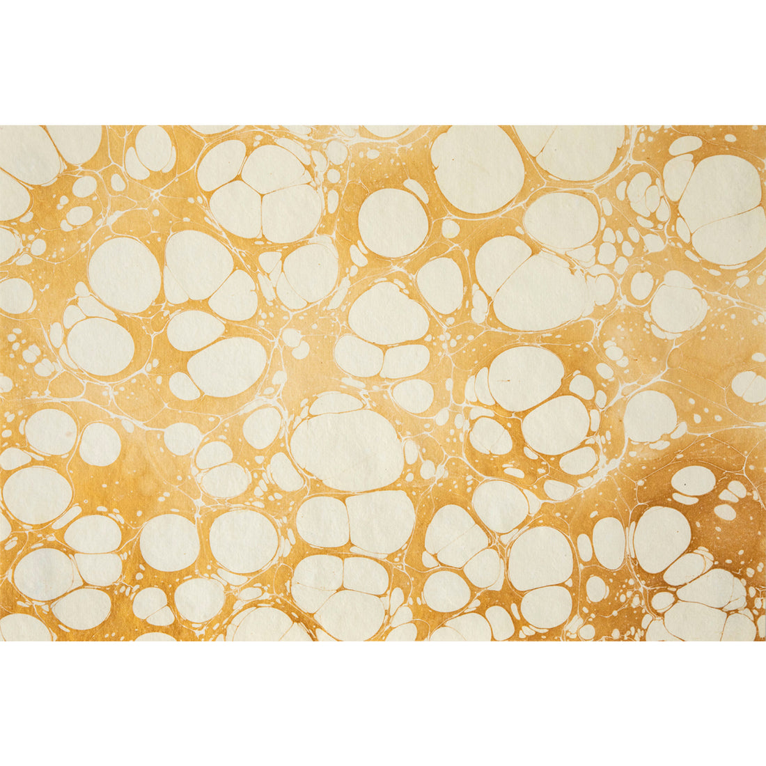 An abstract, marbled pattern of white bubbles scattered in gold ink.
