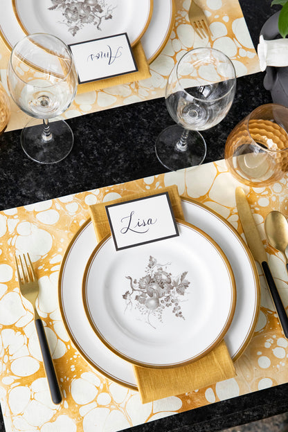 The Gold Stone Marbled Placemat used in an elegant table setting for two.